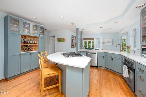 a kitchen with a sink and a large window