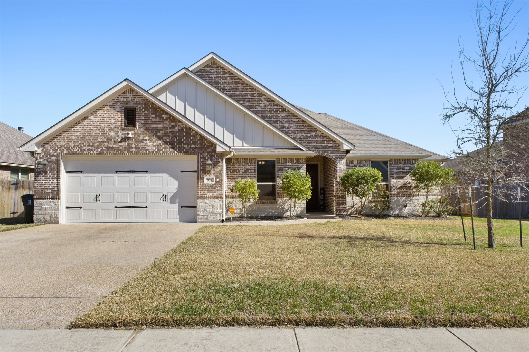3010 Nobel Court Bryan, TX 77808 - Photo 1 of 23 a front view of a house with garden