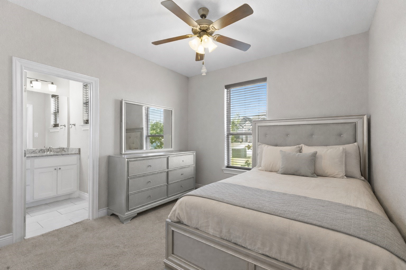 3010 Nobel Court Bryan, TX 77808 - Photo 13 of 23 a bedroom with a bed and a chandelier fan