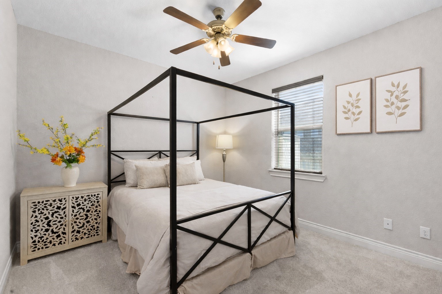 3010 Nobel Court Bryan, TX 77808 - Photo 17 of 23 a bedroom with a bed and a lamp on a dresser