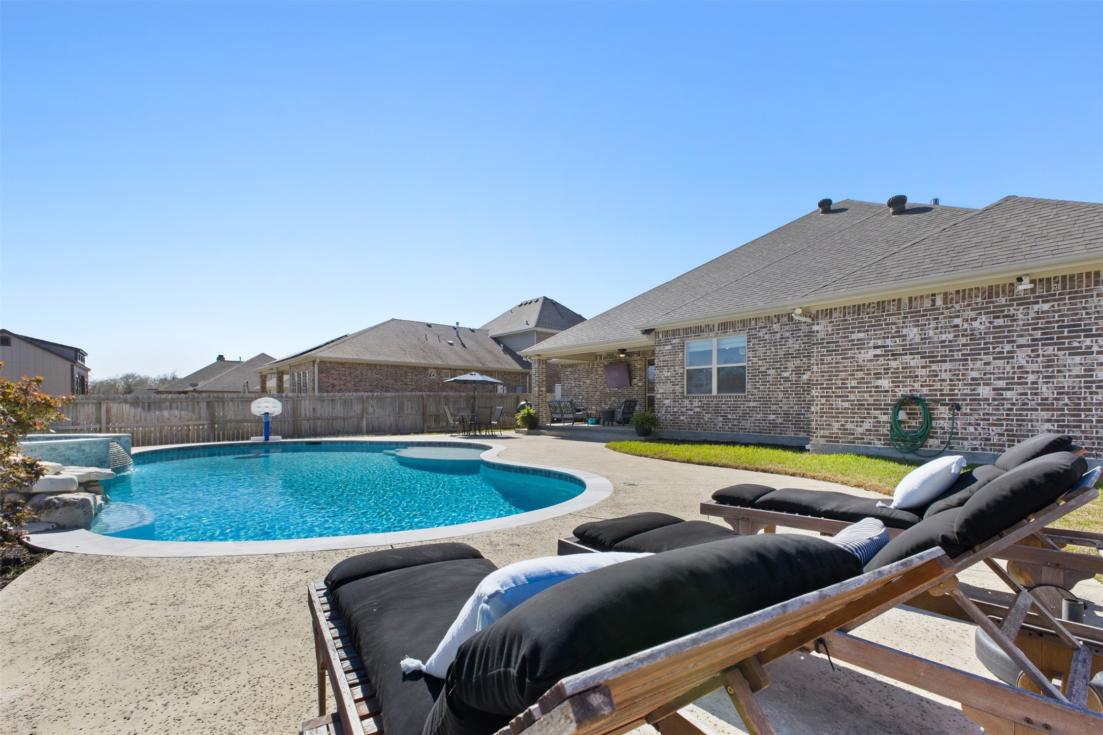 3010 Nobel Court Bryan, TX 77808 - Photo 21 of 23 a view of a house with pool and chairs