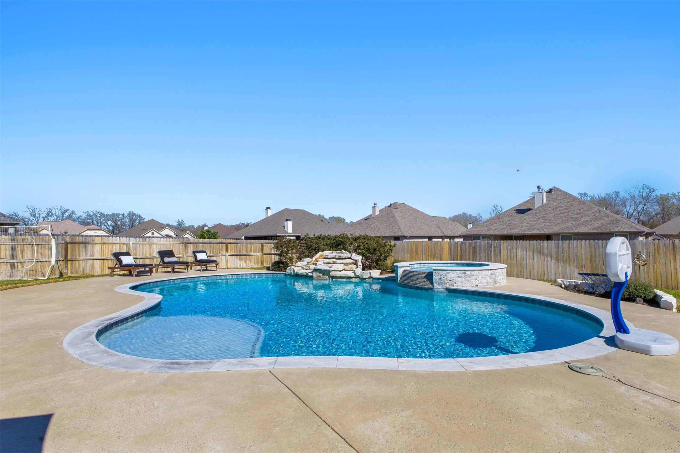 3010 Nobel Court Bryan, TX 77808 - Photo 22 of 23 a view of a swimming pool and a mountain
