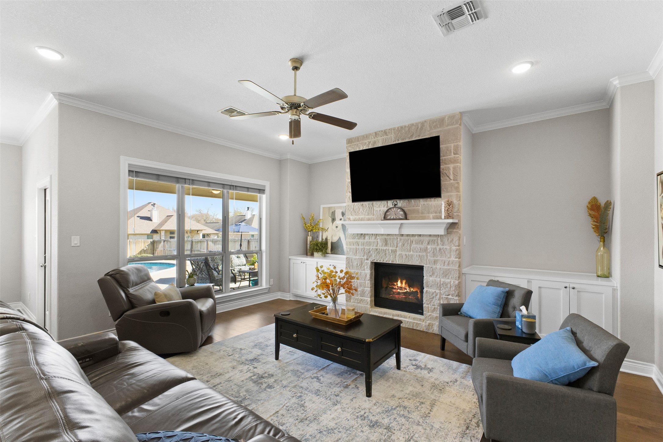 3010 Nobel Court Bryan, TX 77808 - Photo 3 of 23 a living room with furniture fireplace and flat screen tv