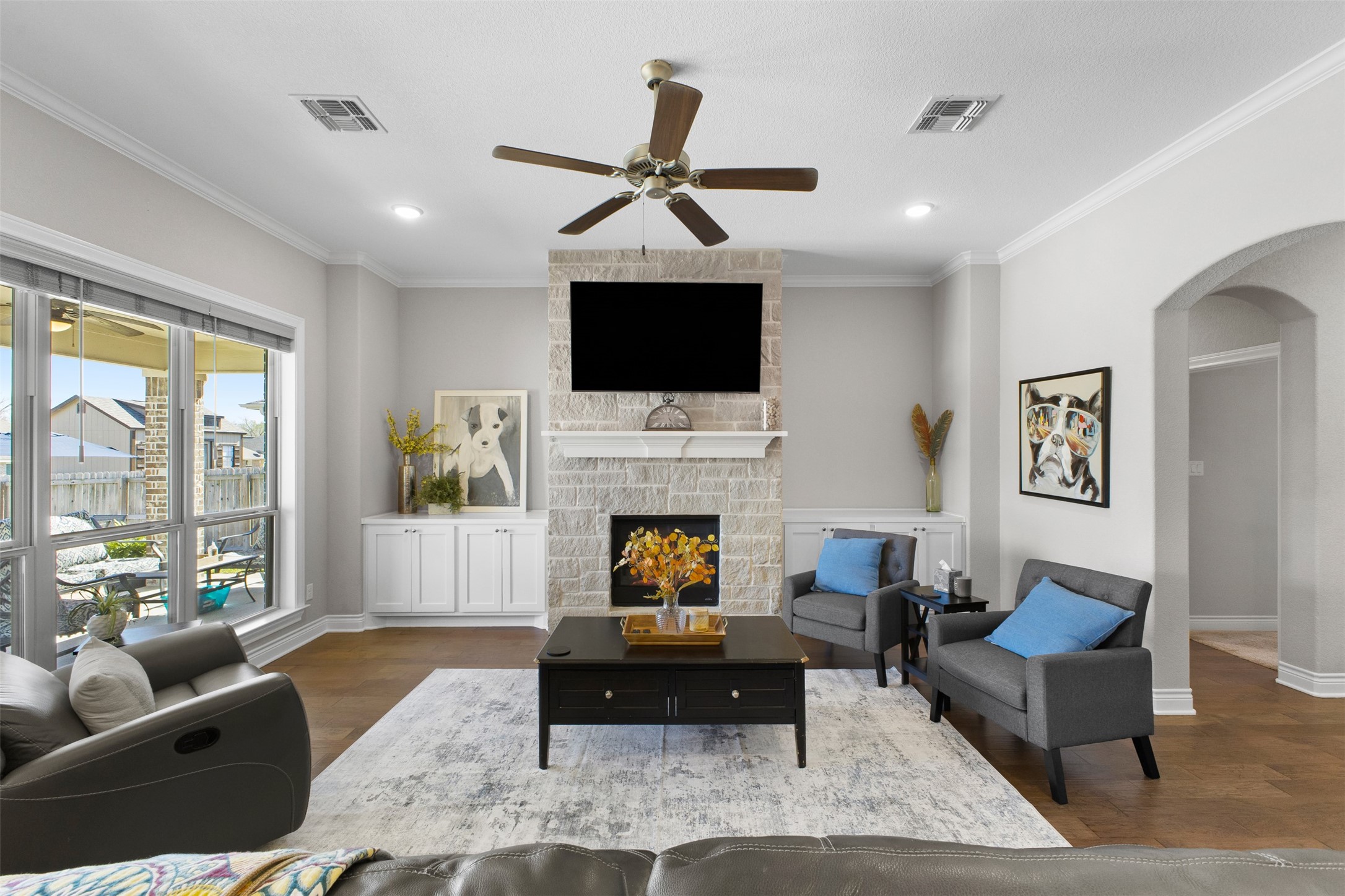 3010 Nobel Court Bryan, TX 77808 - Photo 5 of 23 a living room with furniture a fireplace and a flat screen tv