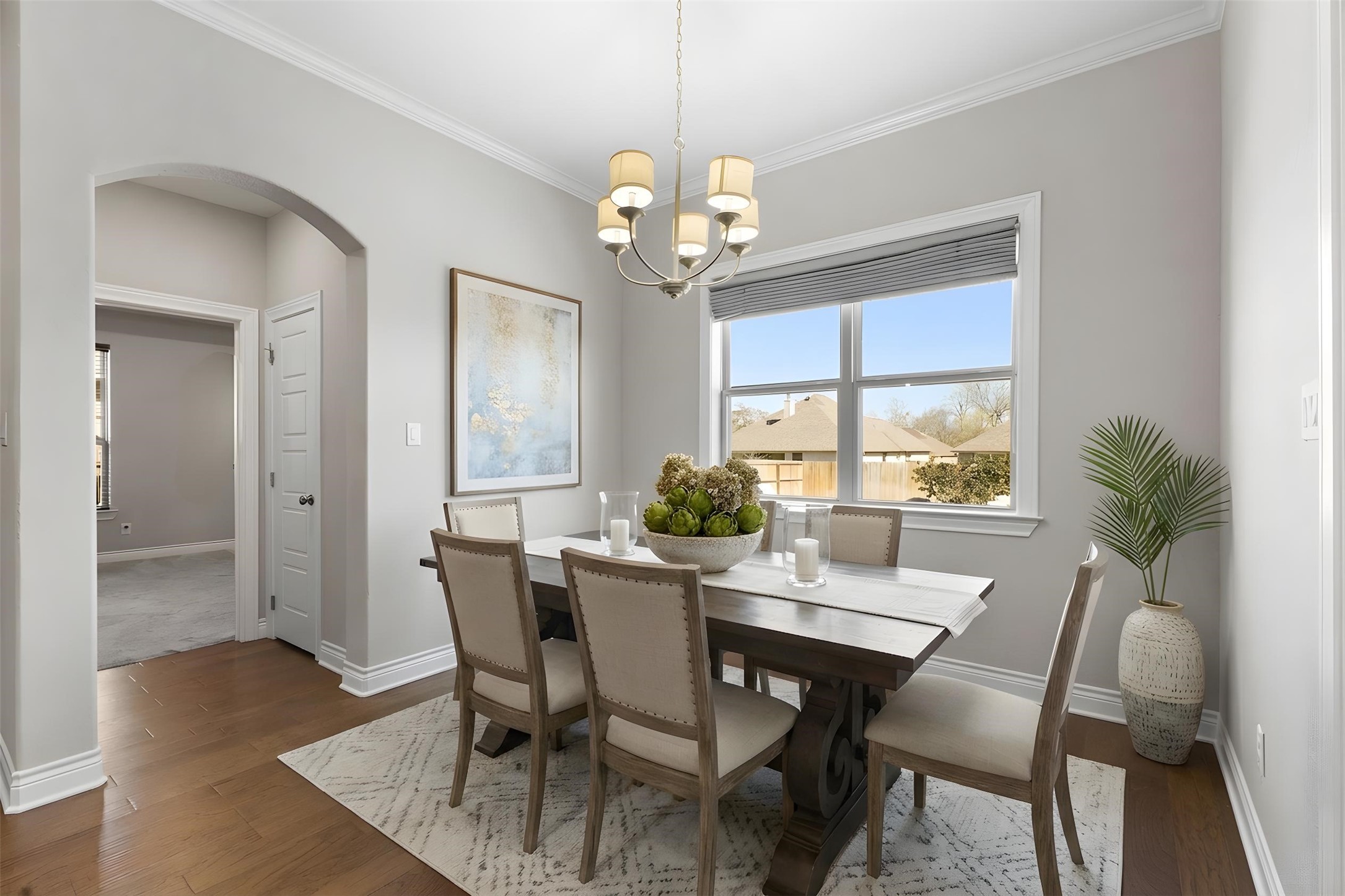 3010 Nobel Court Bryan, TX 77808 - Photo 6 of 23 a view of a dining room with furniture a chandelier and wooden floor