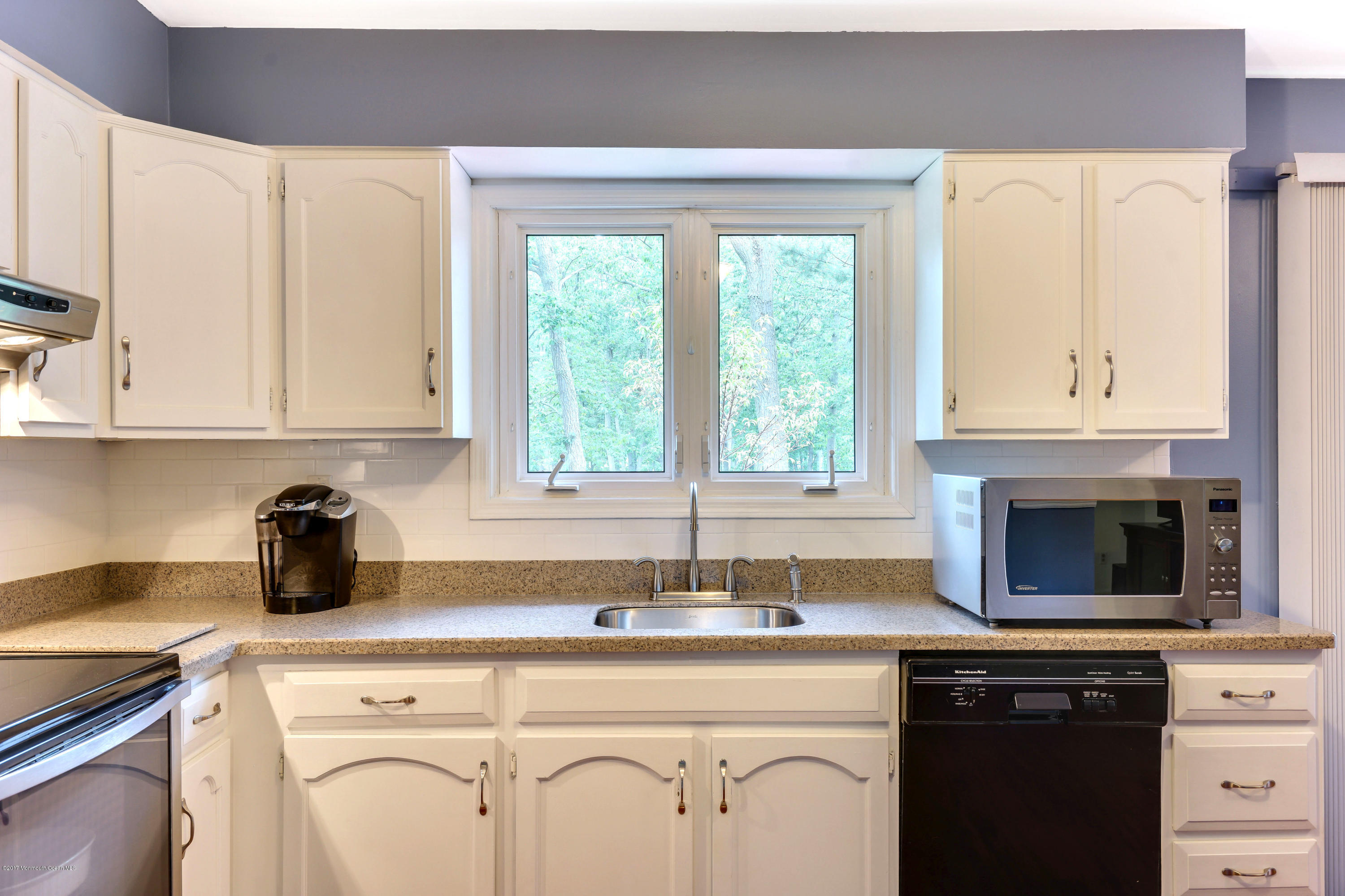 894 Bethel Church Road Jackson, NJ 08527 - Photo 13 of 41 a kitchen with white cabinets and a sink