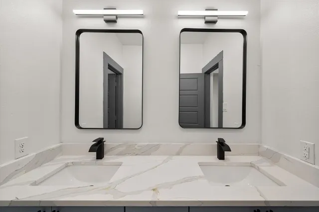 a bathroom with mirror and