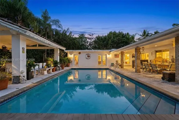 a view of a swimming pool with a porch