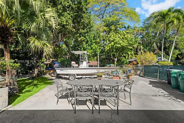 a view of backyard with sitting area