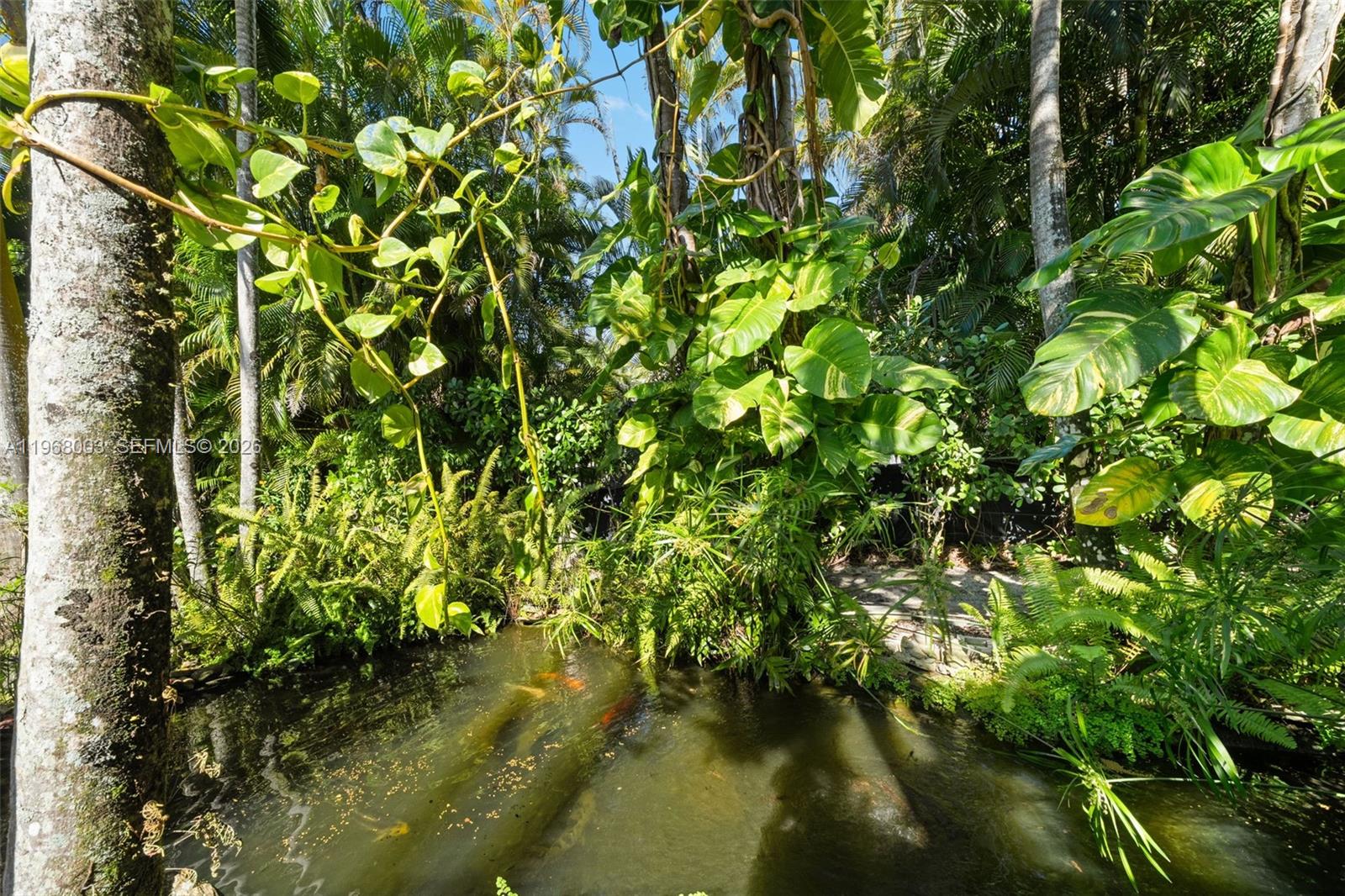 11220 Southwest 67th Avenue Pinecrest, FL 33156 - Photo 32 of 42 a view of a garden