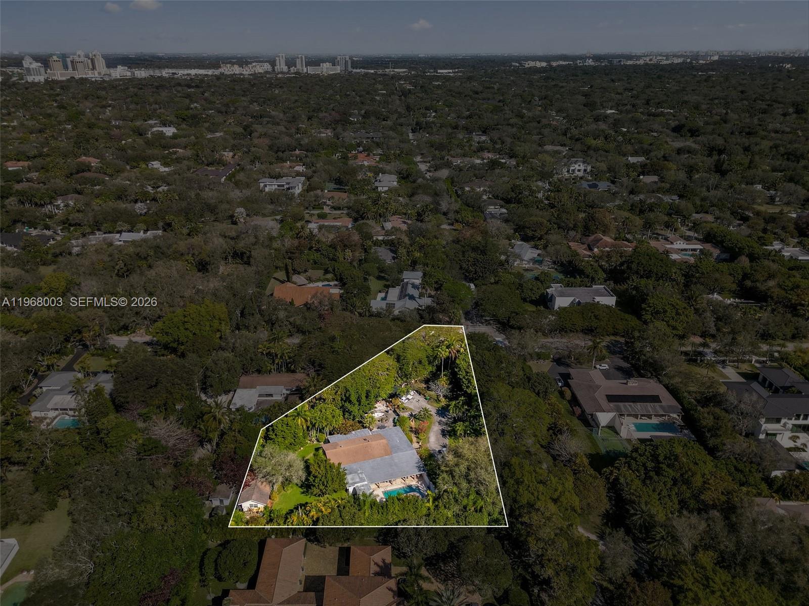 11220 Southwest 67th Avenue Pinecrest, FL 33156 - Photo 4 of 42 an aerial view of house with yard