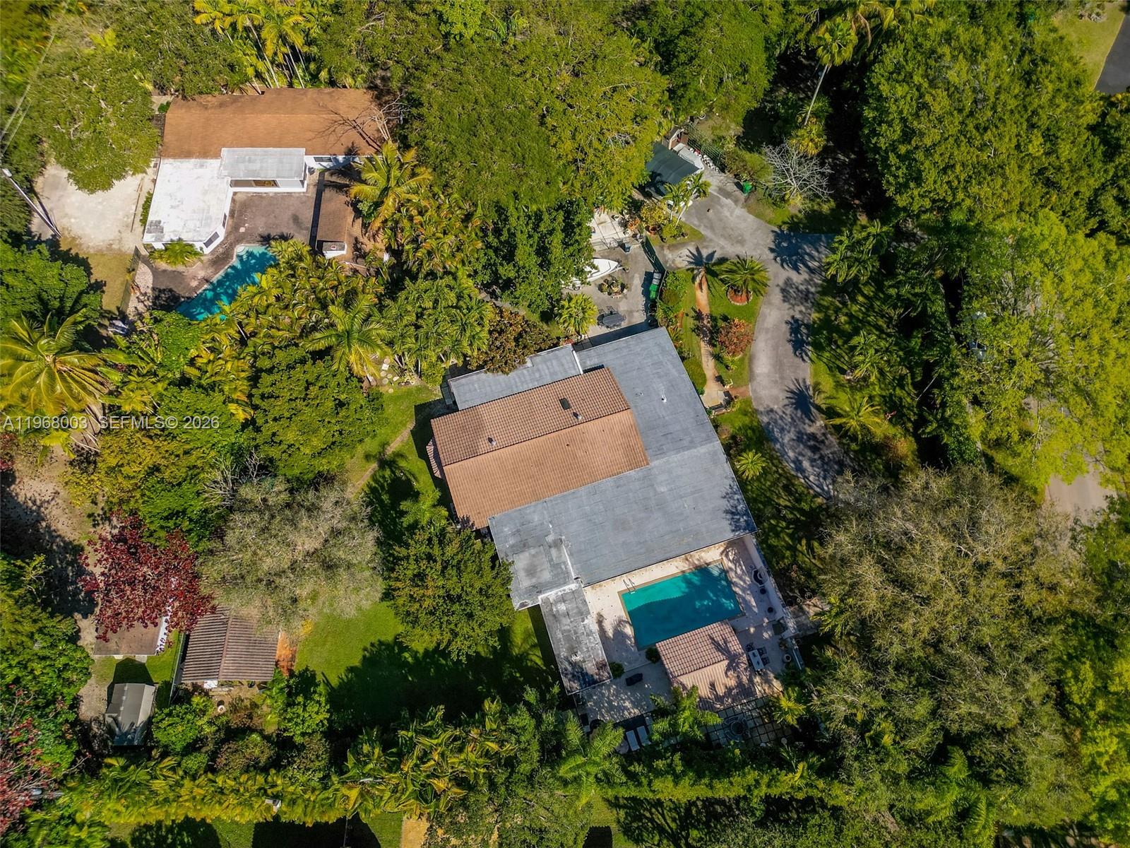 11220 Southwest 67th Avenue Pinecrest, FL 33156 - Photo 7 of 42 an aerial view of a house with outdoor space and a street view