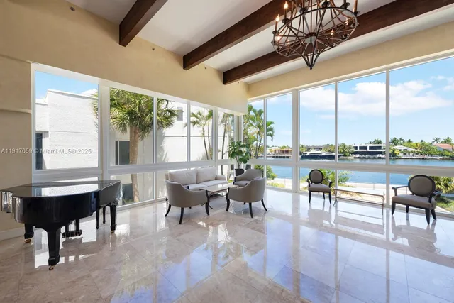 a view of a swimming pool with a table and chairs