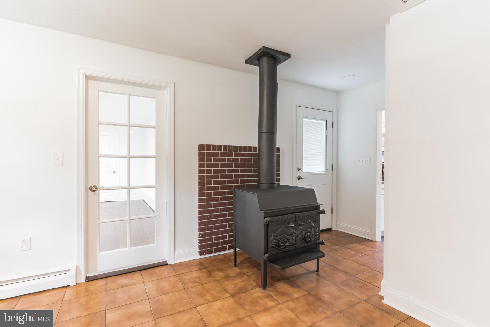 275 Dutch Mill Road Malaga, NJ 08328 - Photo 19 of 29 Vestibule with Wood Stove