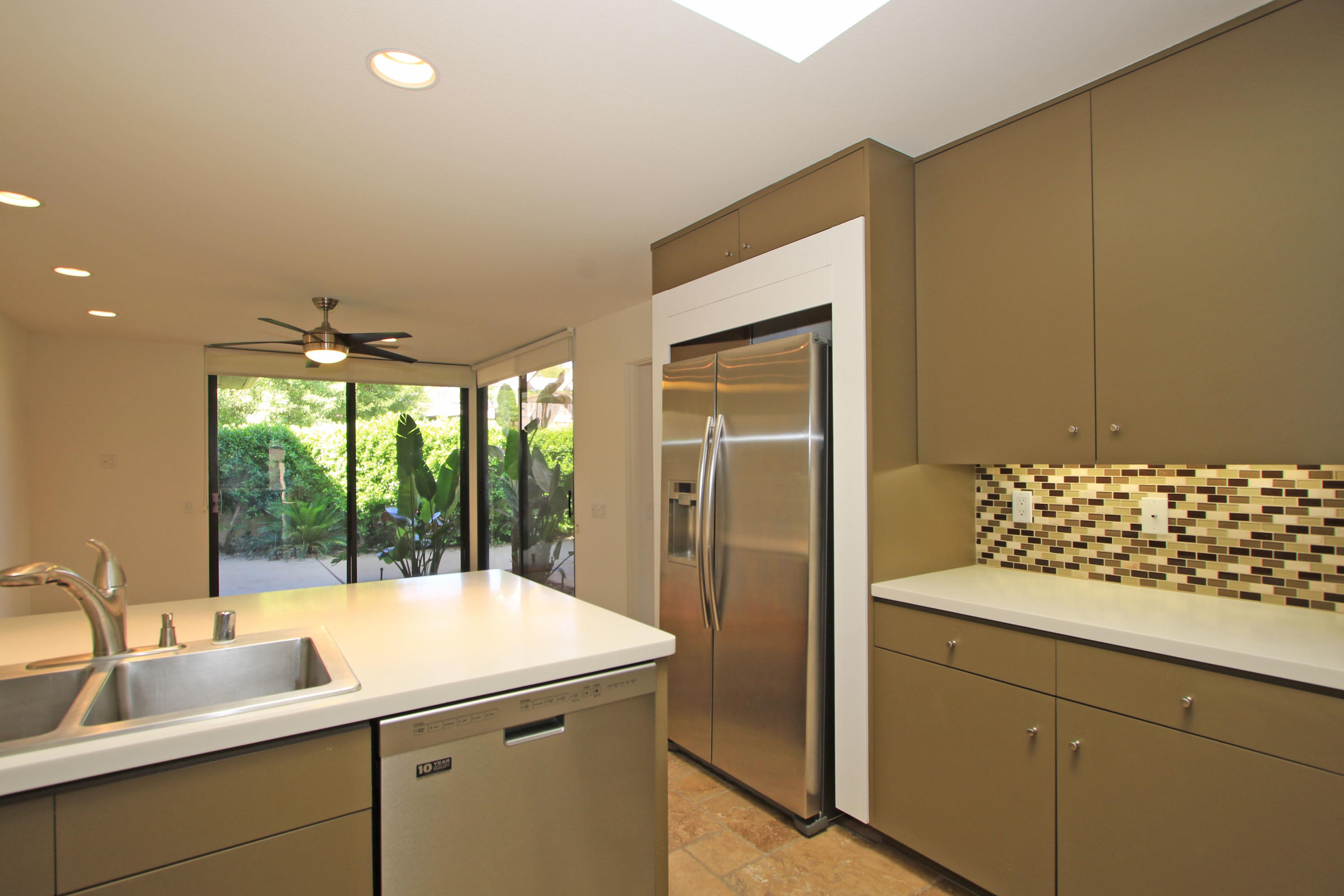 14 Colgate Drive Rancho Mirage, CA 92270 - Photo 12 of 46 a kitchen with a sink and cabinets