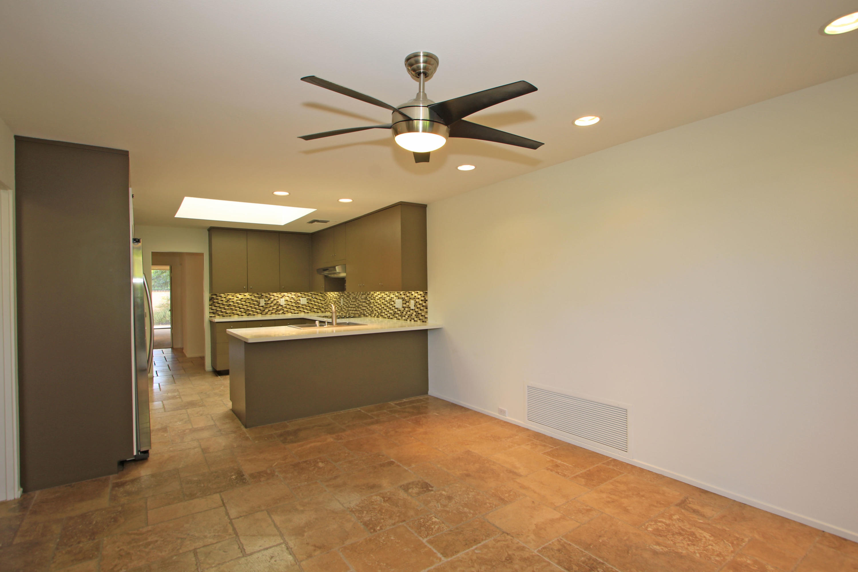 14 Colgate Drive Rancho Mirage, CA 92270 - Photo 15 of 46 a view of a kitchen with a sink and a refrigerator