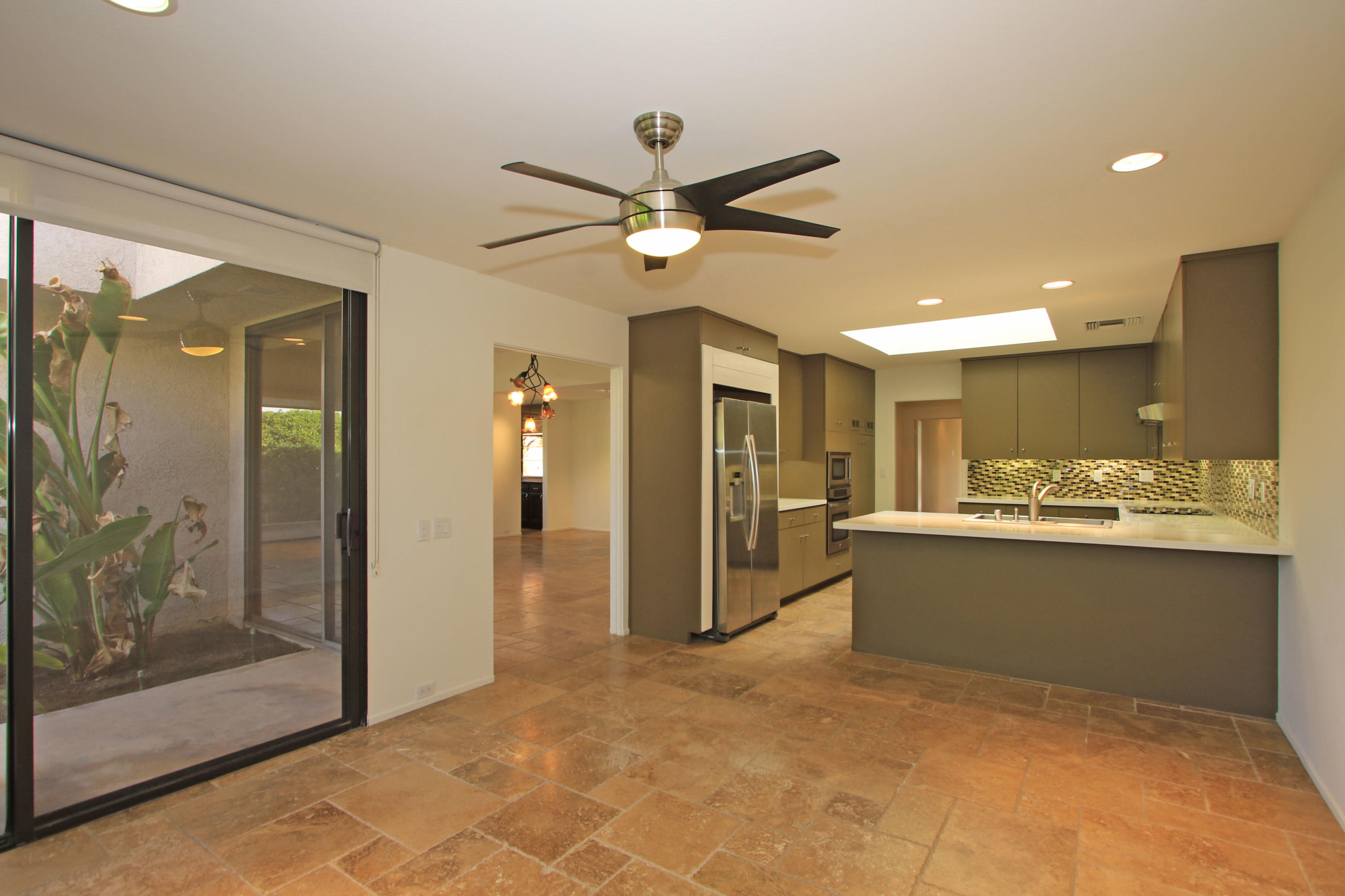 14 Colgate Drive Rancho Mirage, CA 92270 - Photo 16 of 46 a view of workspace with wooden floor and a ceiling fan
