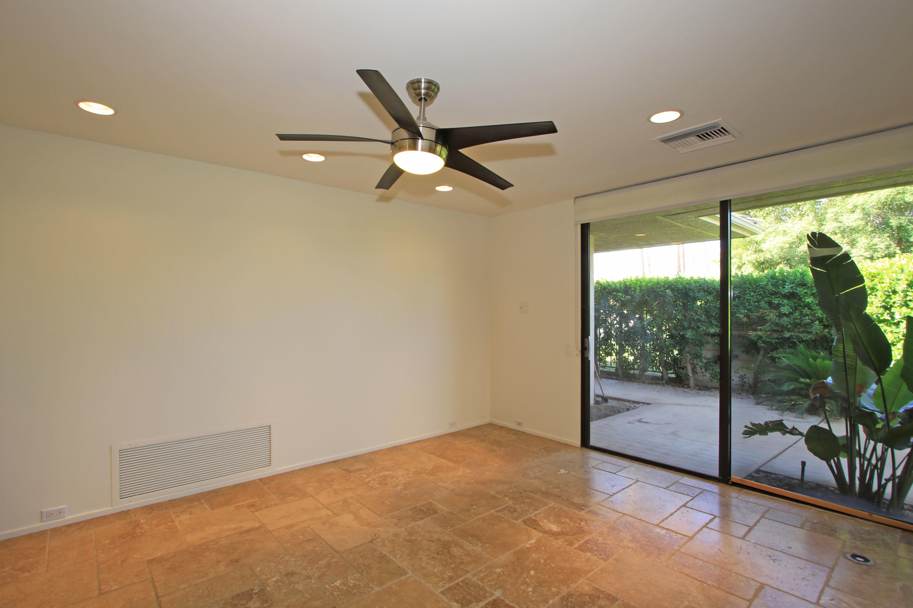 14 Colgate Drive Rancho Mirage, CA 92270 - Photo 18 of 46 a view of a big room with yard ceiling fan and windows