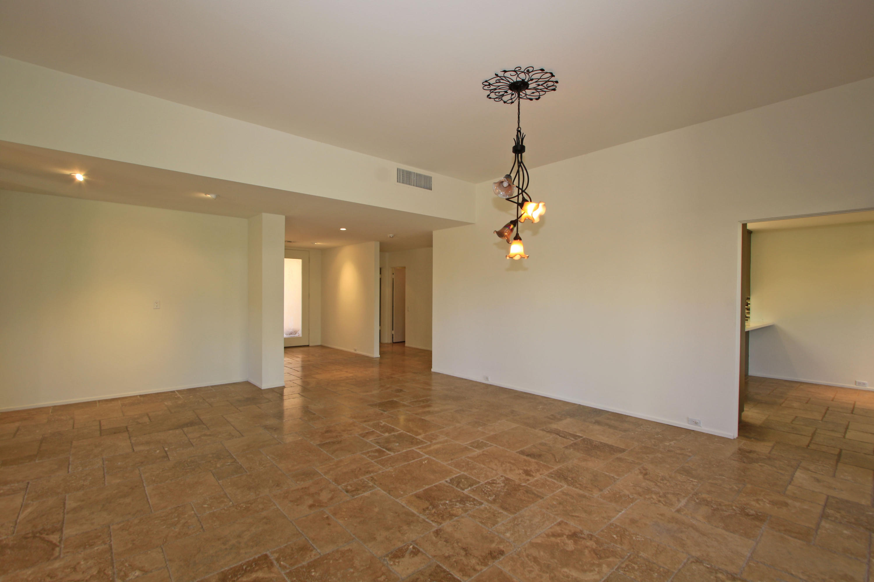 14 Colgate Drive Rancho Mirage, CA 92270 - Photo 20 of 46 a view of an empty room with chandelier fan