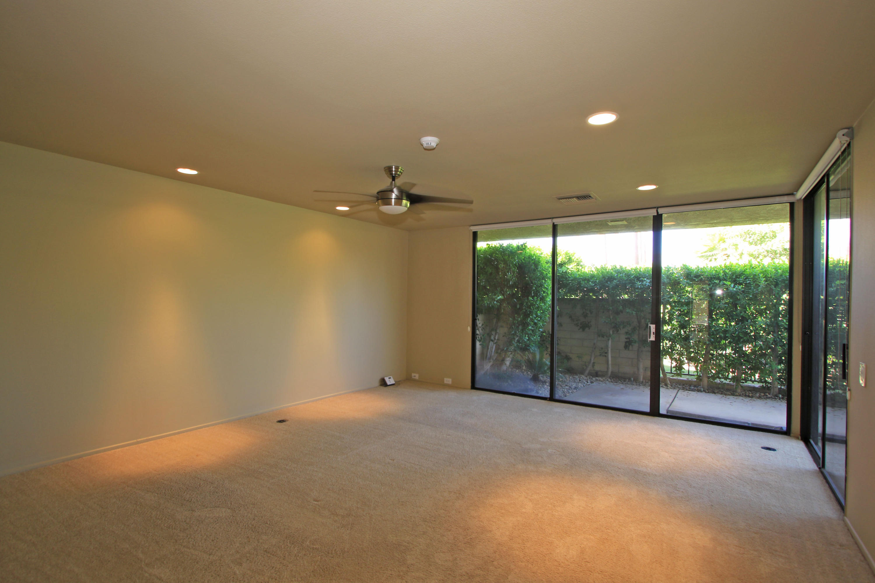 14 Colgate Drive Rancho Mirage, CA 92270 - Photo 23 of 46 a view of an empty room with glass door