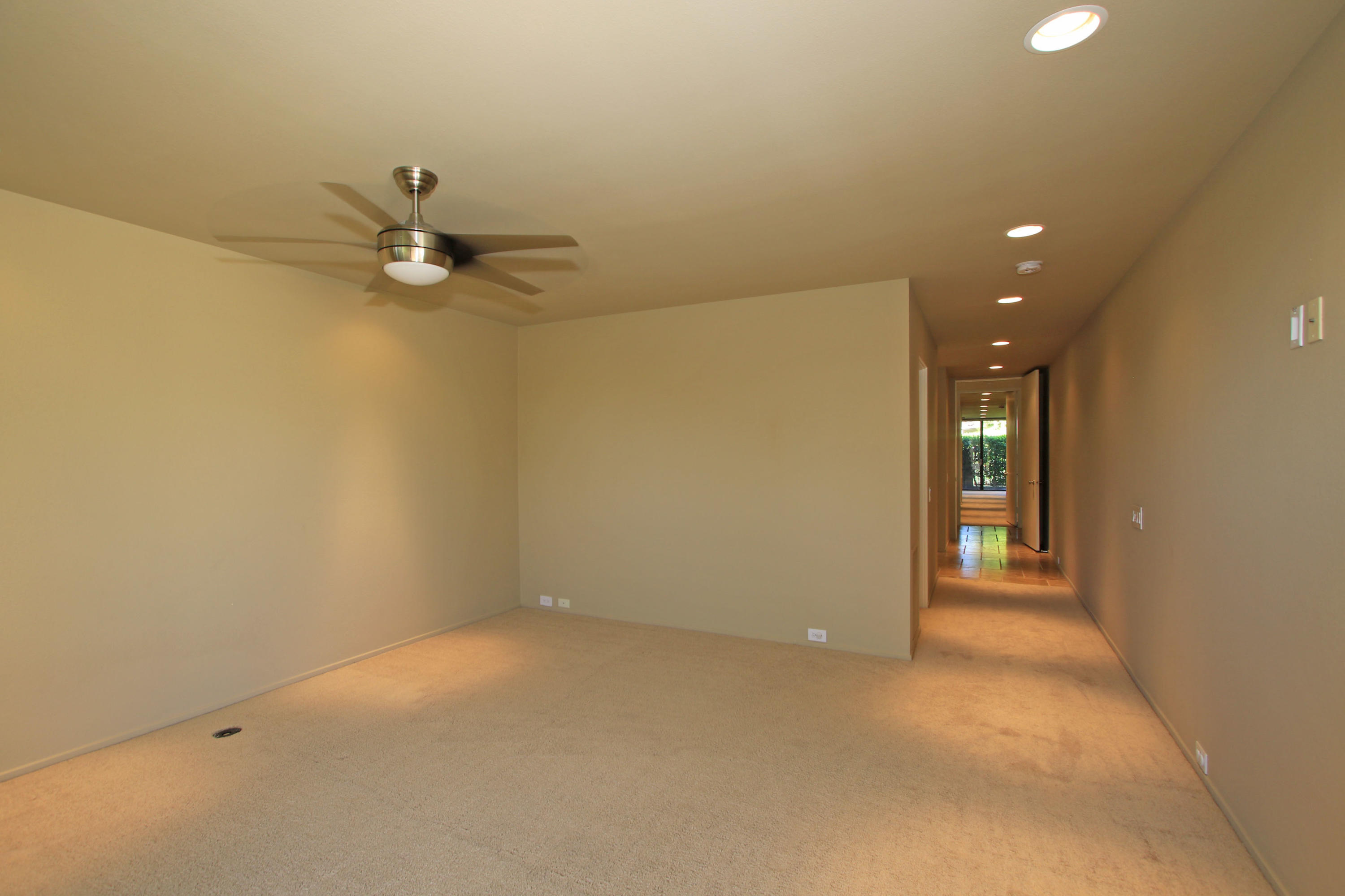 14 Colgate Drive Rancho Mirage, CA 92270 - Photo 30 of 46 a view of a room with a hanging light