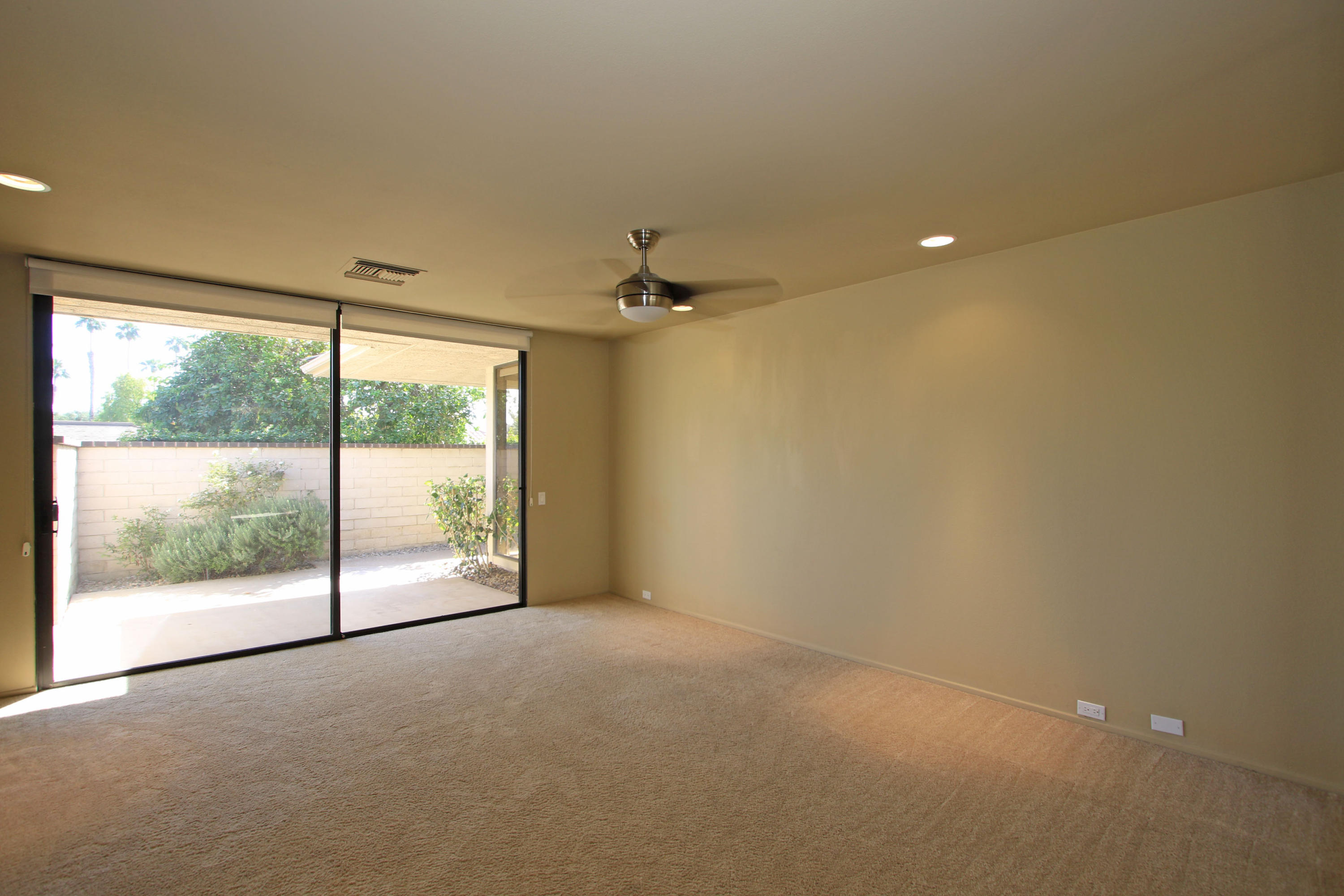 14 Colgate Drive Rancho Mirage, CA 92270 - Photo 34 of 46 a view of a livingroom with a ceiling fan and window