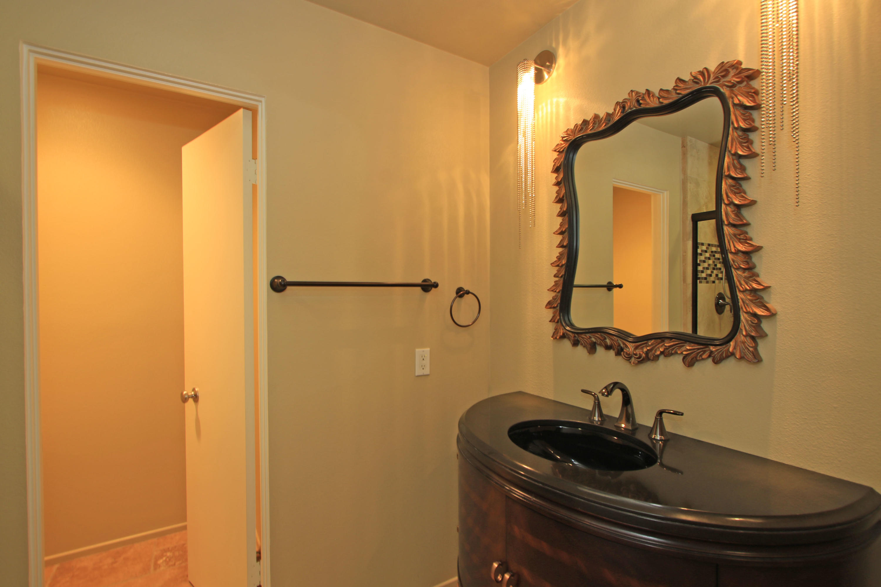 14 Colgate Drive Rancho Mirage, CA 92270 - Photo 36 of 46 a bathroom with a sink and a mirror