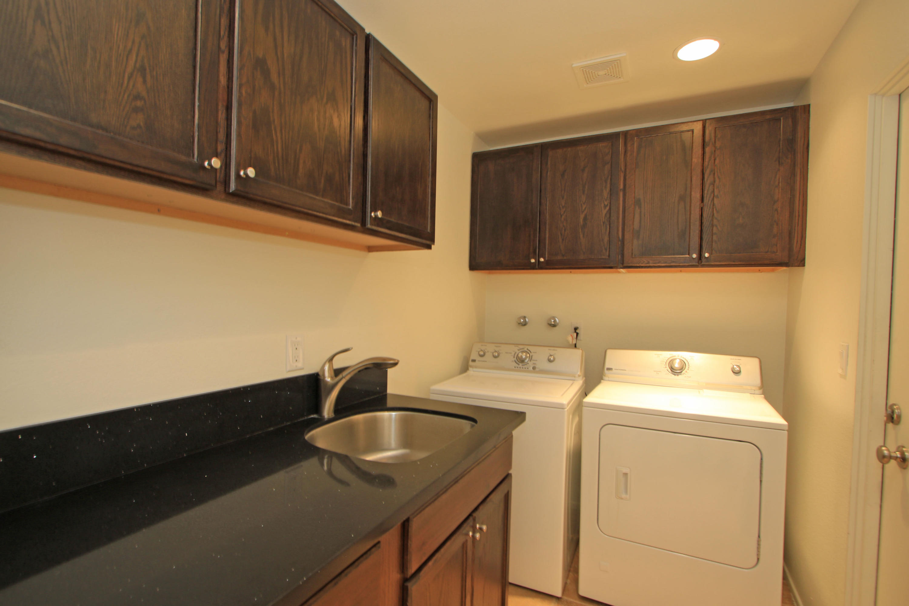 14 Colgate Drive Rancho Mirage, CA 92270 - Photo 38 of 46 a utility room with sink dryer and washer