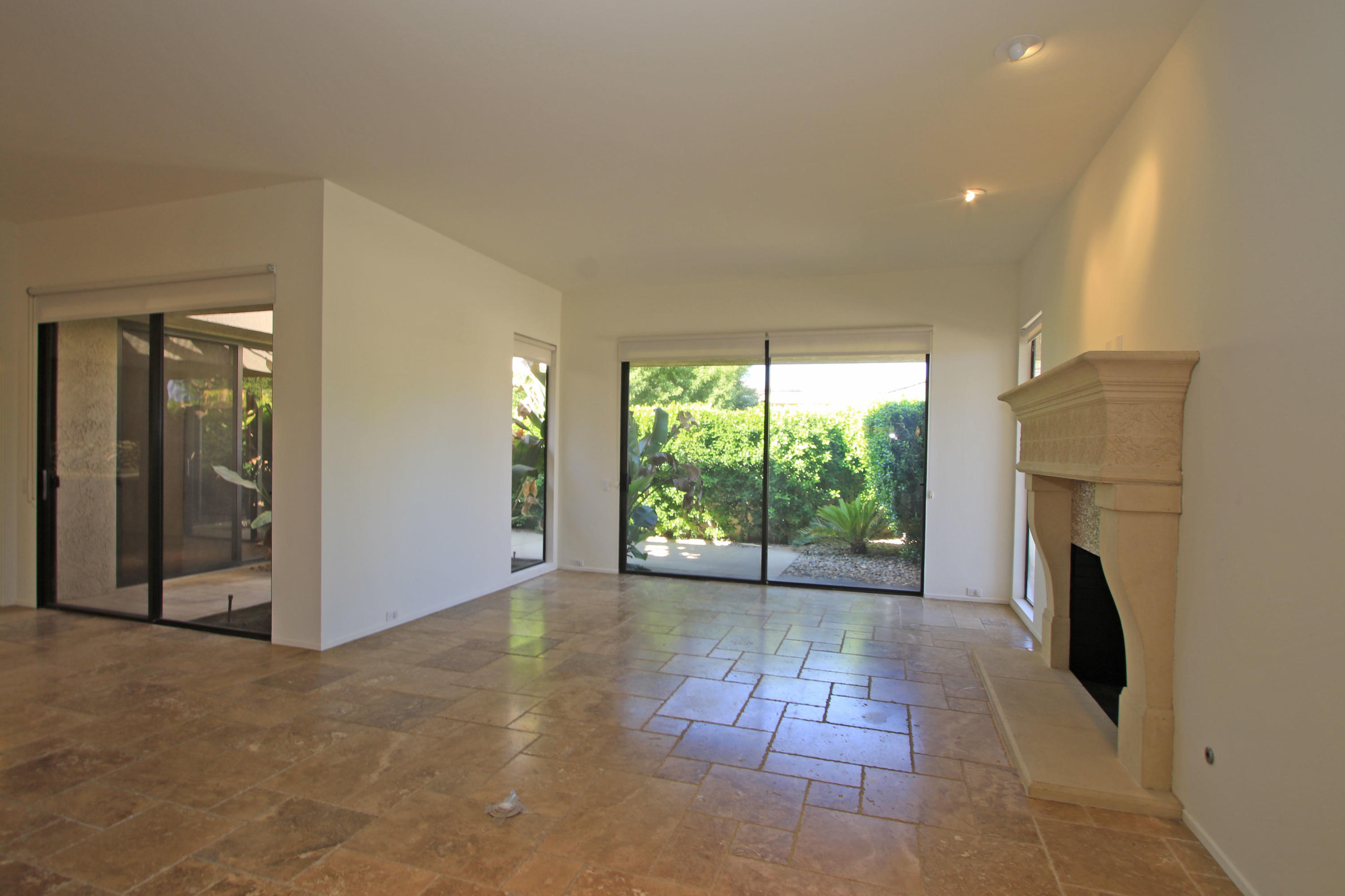 14 Colgate Drive Rancho Mirage, CA 92270 - Photo 6 of 46 a view of an empty room with a fireplace and a window