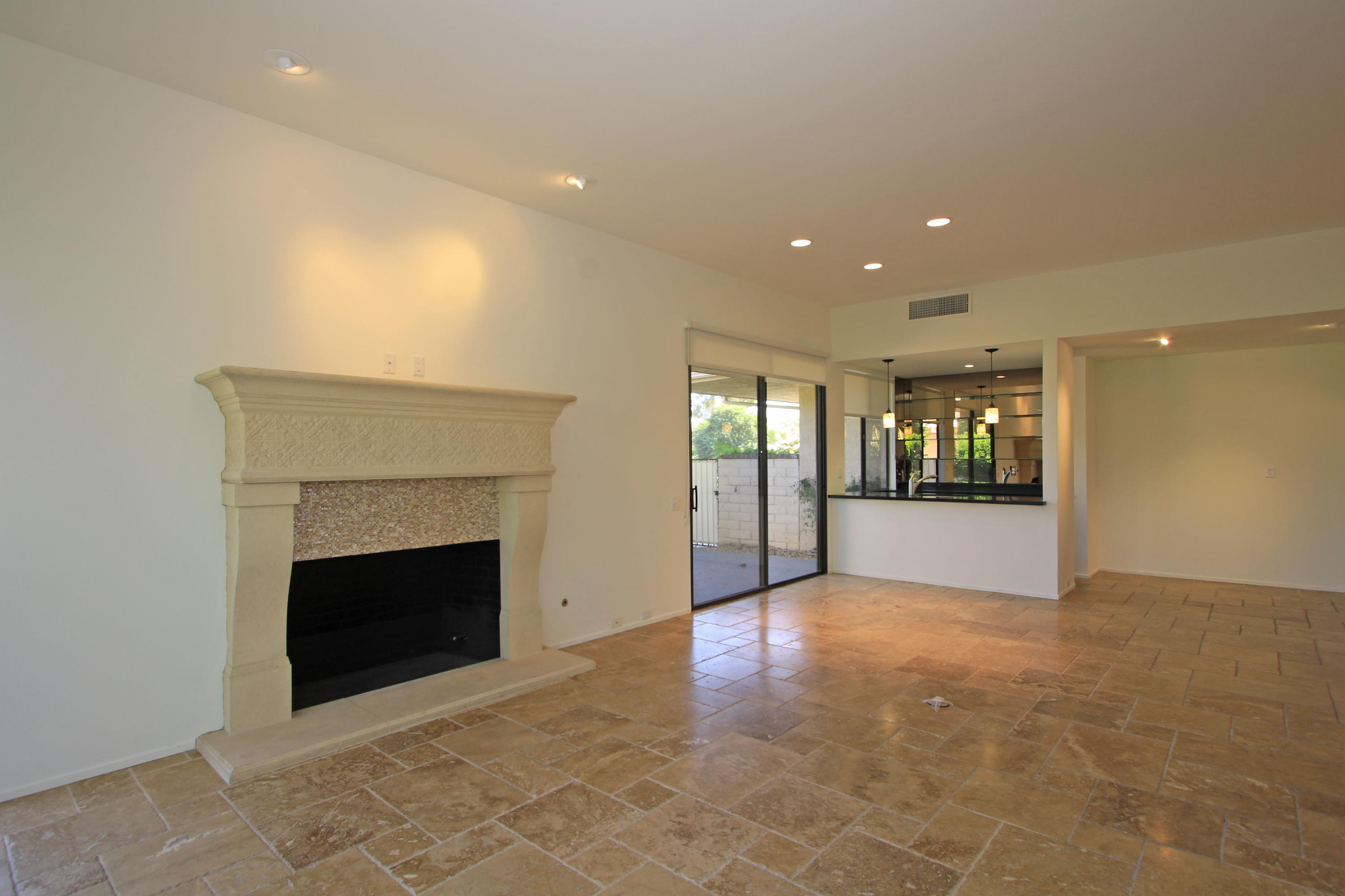 14 Colgate Drive Rancho Mirage, CA 92270 - Photo 9 of 46 a view of an empty room with a fireplace