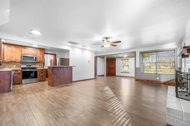 a view of kitchen with furniture and wooden floor
