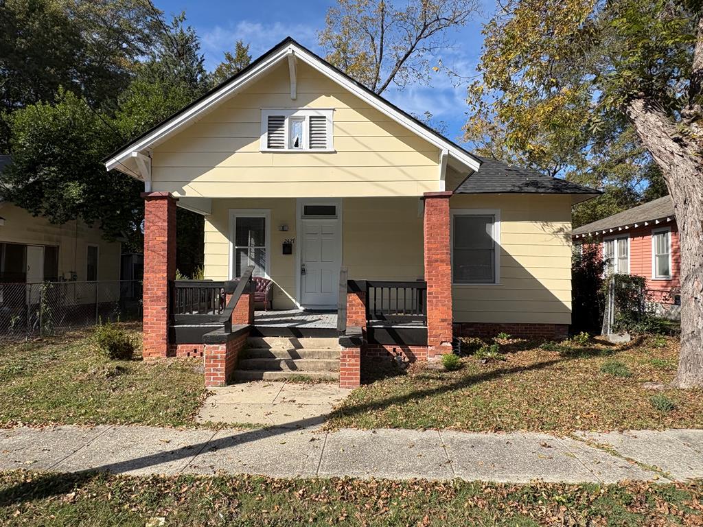 a front view of house with street