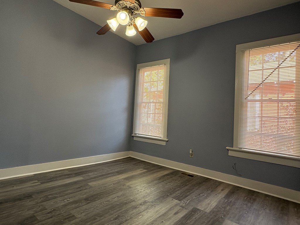 2427 Marion Street Columbus, GA 31906 - Photo 15 of 23 a view of an empty room with wooden floor and a window