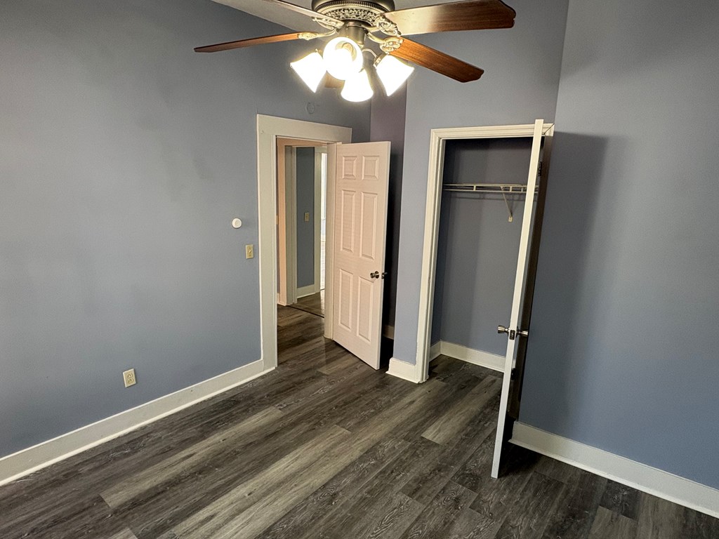2427 Marion Street Columbus, GA 31906 - Photo 16 of 23 wooden floor in an empty room with a window