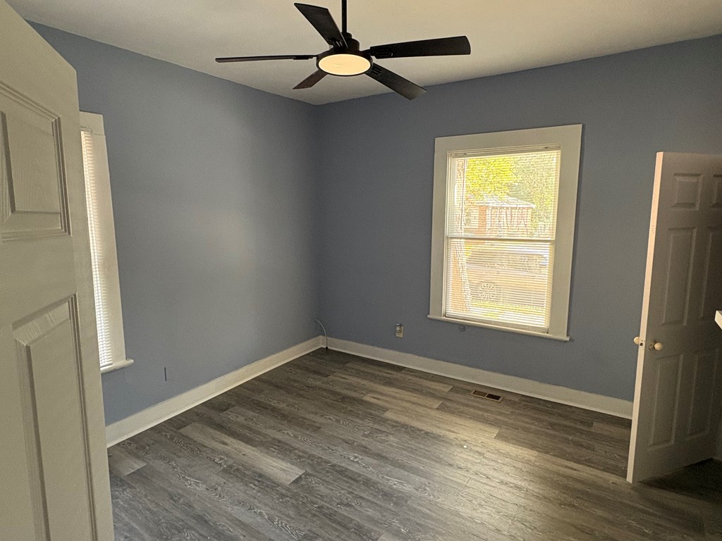 2427 Marion Street Columbus, GA 31906 - Photo 19 of 23 a view of an empty room with wooden floor and a window