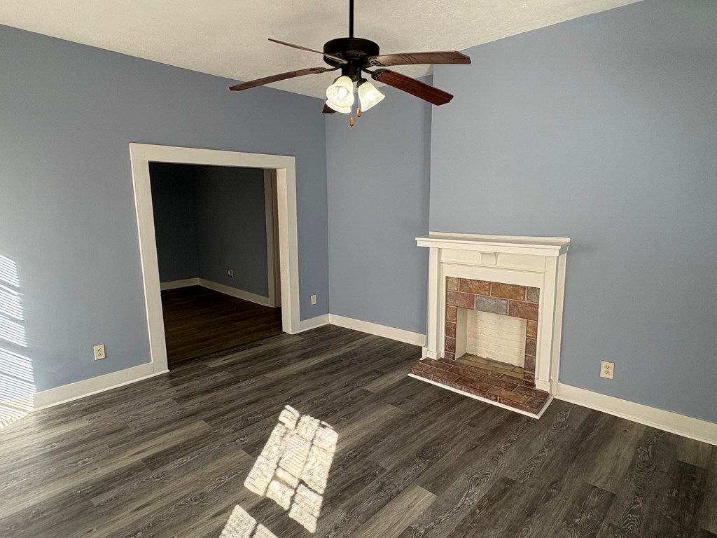 2427 Marion Street Columbus, GA 31906 - Photo 4 of 23 a view of empty room with wooden floor and fan