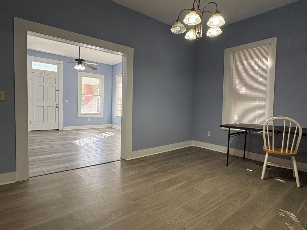 2427 Marion Street Columbus, GA 31906 - Photo 7 of 23 an empty room with wooden floor and windows
