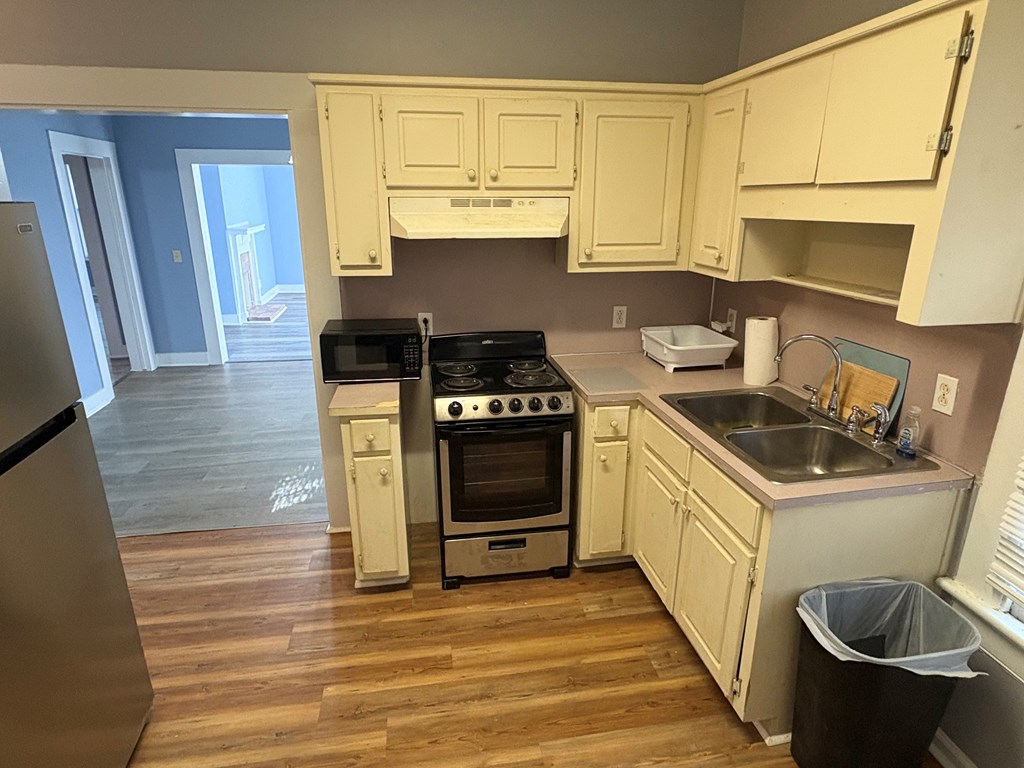2427 Marion Street Columbus, GA 31906 - Photo 10 of 23 a kitchen with a stove and a sink