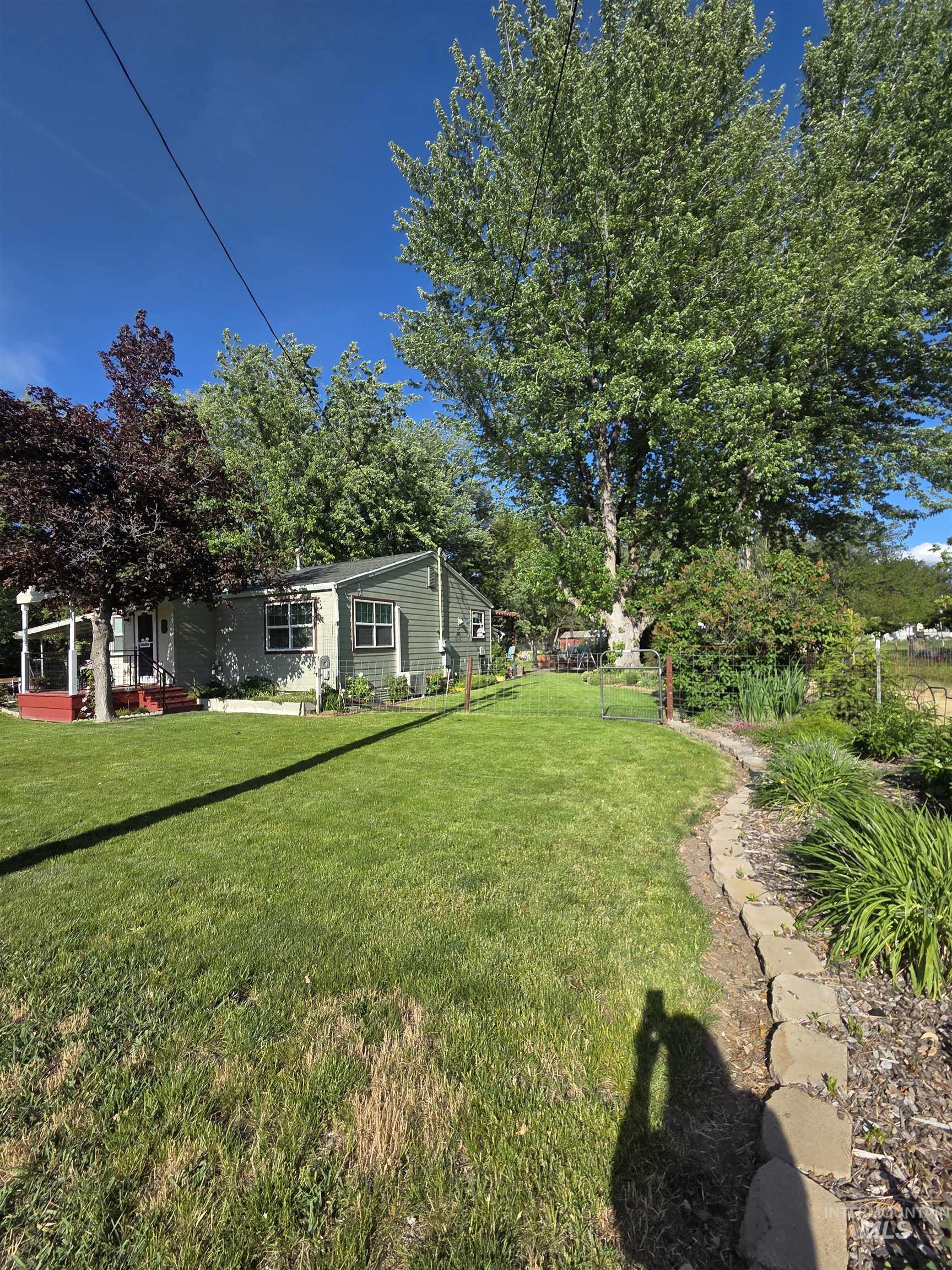 109 South 3rd Street Pomeroy, WA 99347 - Photo 36 of 36 Expansive green lawn with mature trees providing natural shading