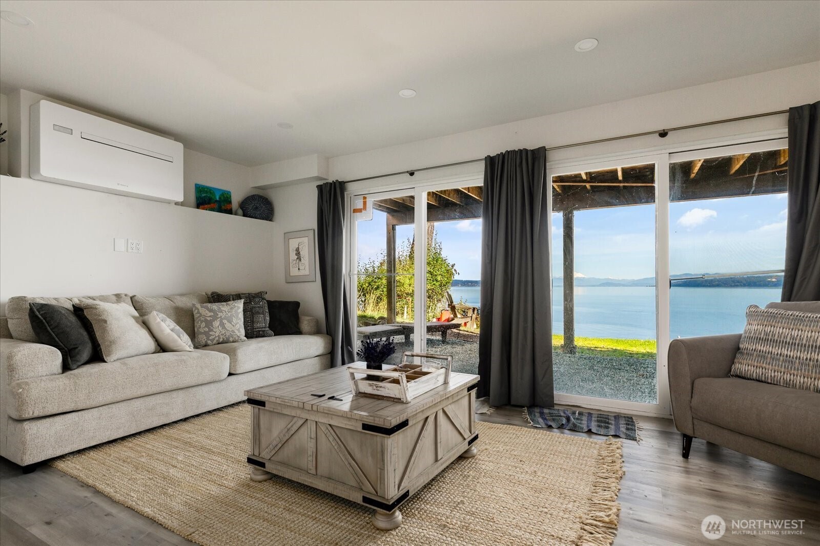 159 South Harrington Lagoon Road Coupeville, WA 98239 - Photo 24 of 37 a living room with furniture and a large window