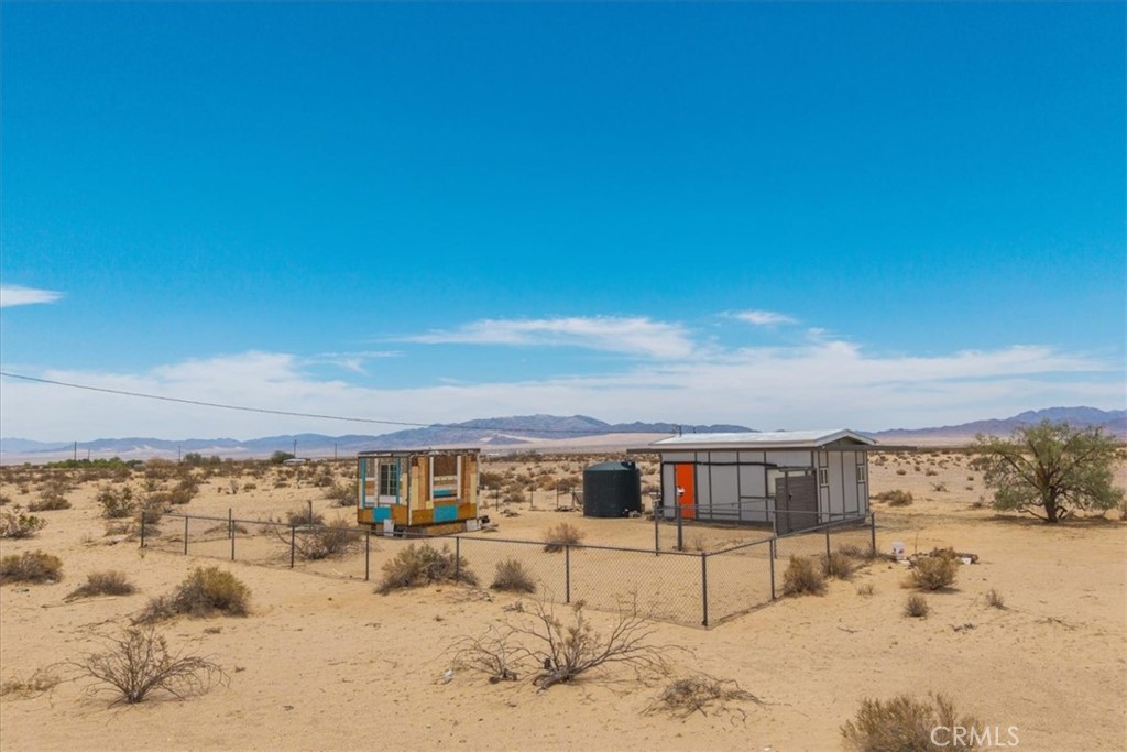 84951 Amboy Road Twentynine Palms, CA 92277 - Photo 22 of 36 a view of houses with snow on the beach