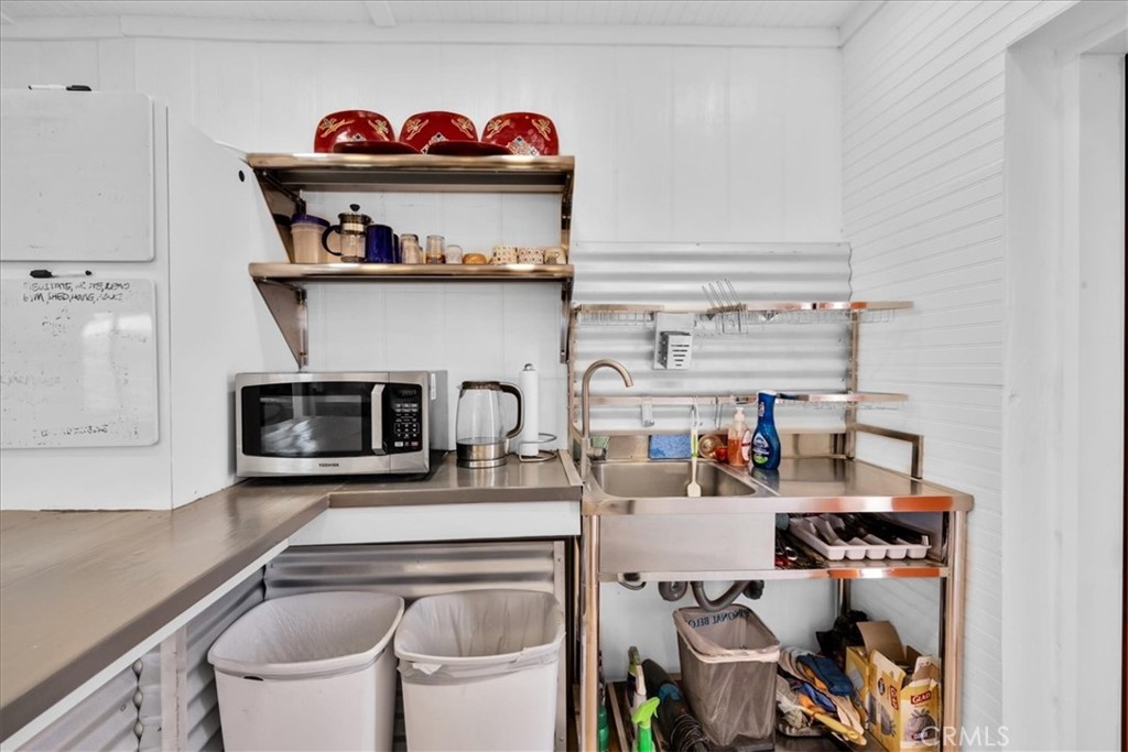 84951 Amboy Road Twentynine Palms, CA 92277 - Photo 8 of 36 a kitchen with a refrigerator and a stove top oven