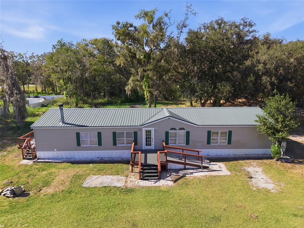 4912 Miley Road Plant City, FL 33565 - Photo 1 of 48 front view of a house with a yard