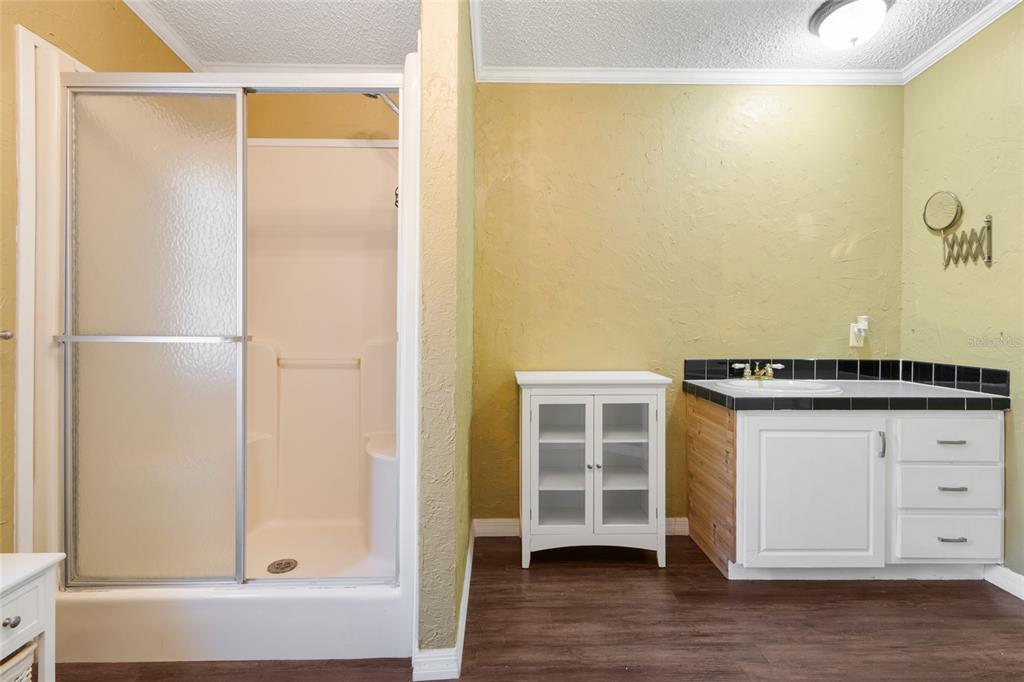 4912 Miley Road Plant City, FL 33565 - Photo 15 of 48 a kitchen with a refrigerator and a sink