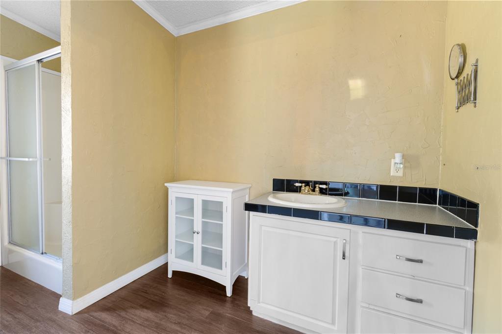 4912 Miley Road Plant City, FL 33565 - Photo 16 of 48 a stove top oven sitting inside of a kitchen