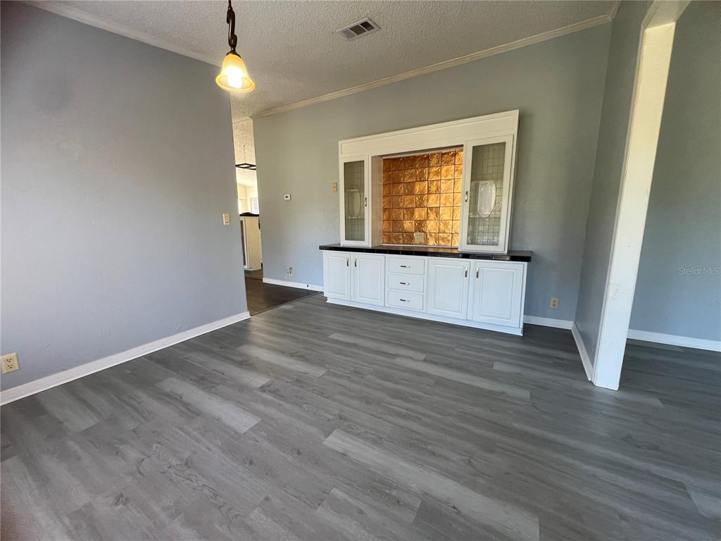 4912 Miley Road Plant City, FL 33565 - Photo 20 of 48 wooden floor in an empty room with a window