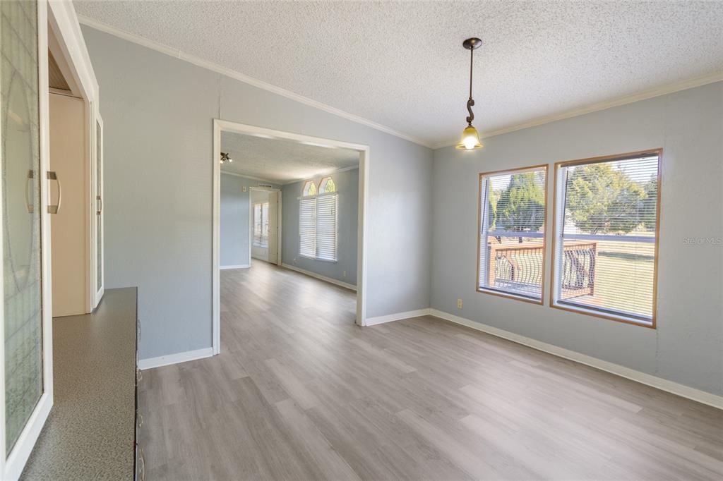 4912 Miley Road Plant City, FL 33565 - Photo 21 of 48 a view of livingroom with window and wooden floor