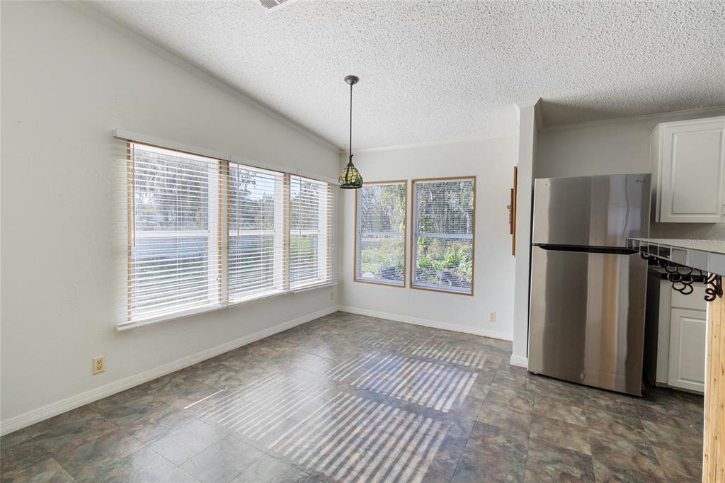 4912 Miley Road Plant City, FL 33565 - Photo 28 of 48 a view of empty room with a kitchen stove back oven