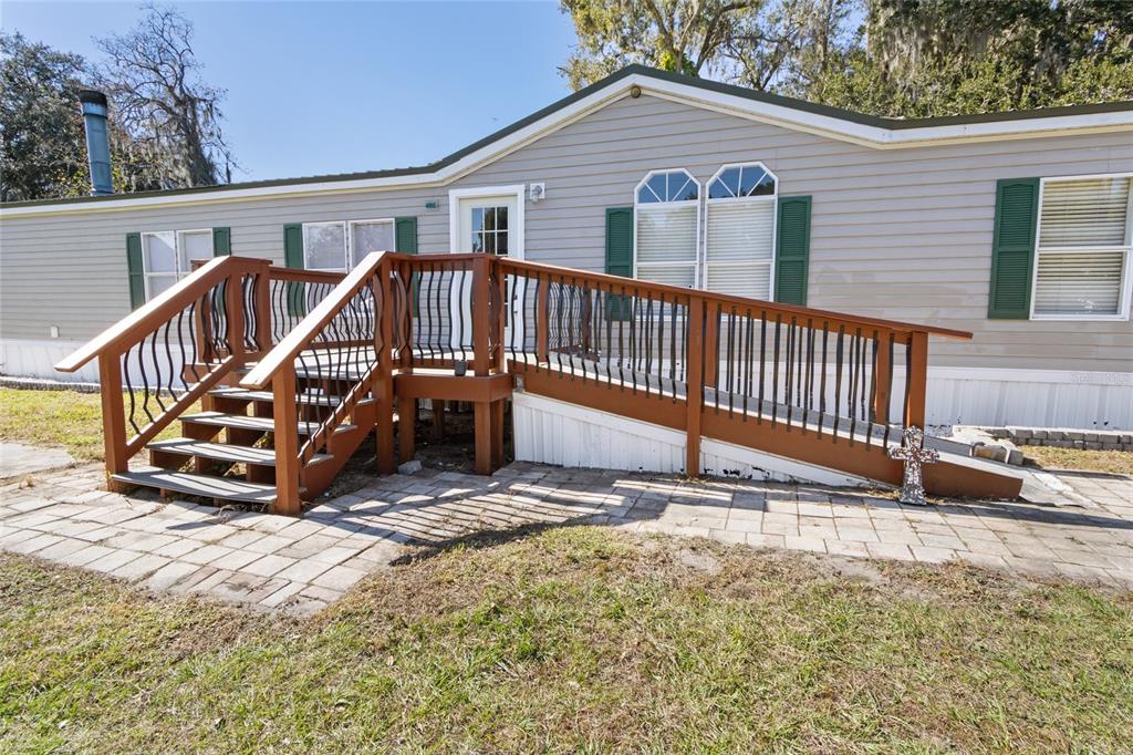 4912 Miley Road Plant City, FL 33565 - Photo 3 of 48 a view of a house with wooden deck front of house