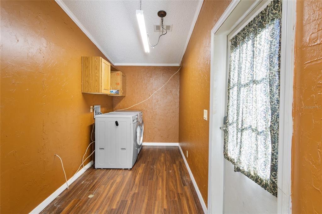 4912 Miley Road Plant City, FL 33565 - Photo 34 of 48 a view of a hallway with wooden floor and staircase